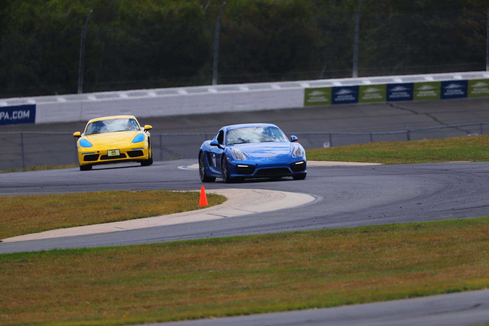 The GrahamStone Cayman GTS leading a 718 Cayman through the Pocono infield